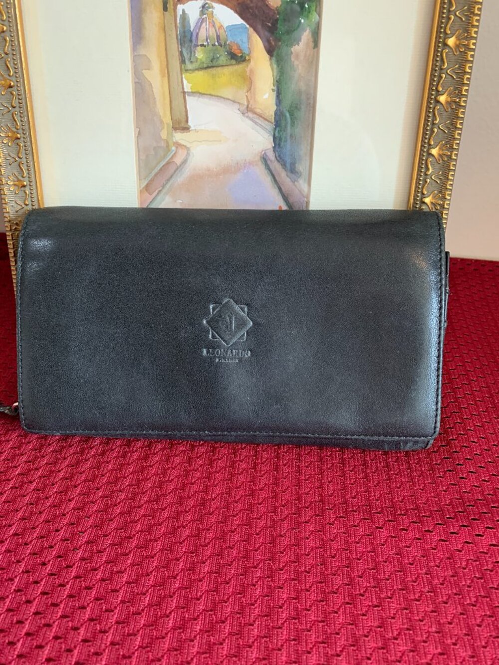 Vintage Leonardo Leatherworks black leather wallet crafted in Florence Italy.